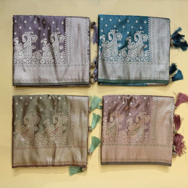 Set of folded sarees with zari borders: dark purple, teal, green, mauve, with tassels