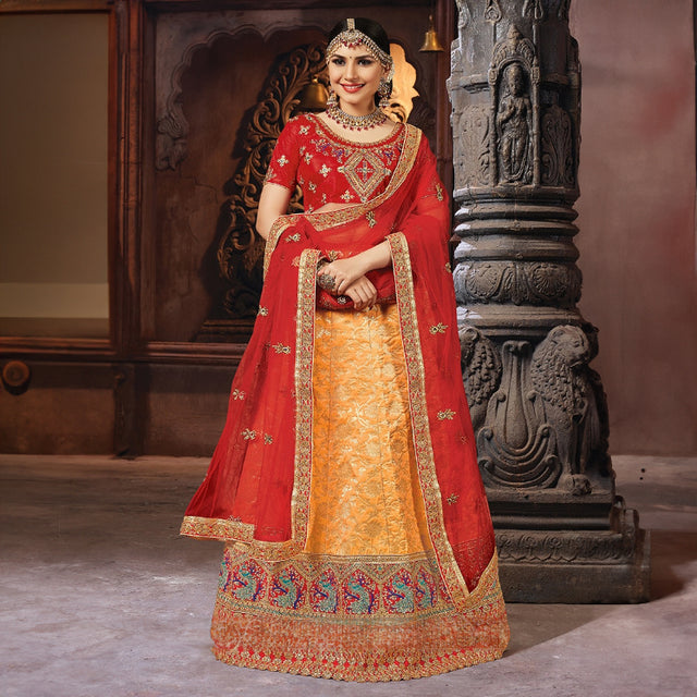 Red and orange Banarasi silk lehenga with matching blouse, ornate woven border