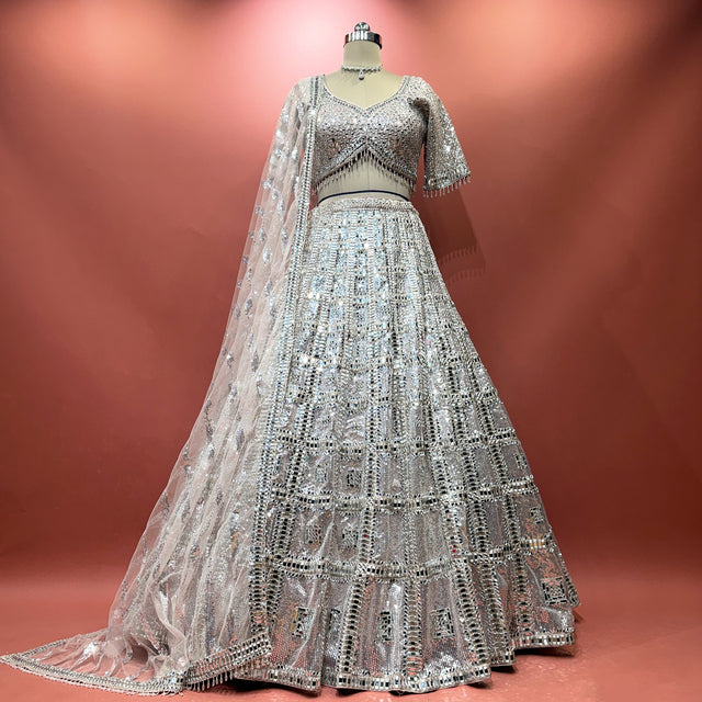 Silver net mirror-work lehenga with long sleeves and flared embellished skirt