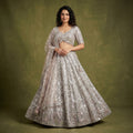 Champagne rose net mirror-work lehenga with full flared skirt and matching dupatta