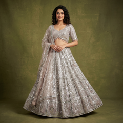Celestial: Champagne Rose Net Heavy Mirror Work Reception Lehenga