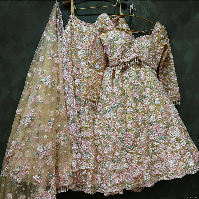 Pastel floral lehenga set with heavily embroidered bodice, full skirt, and sheer dupatta