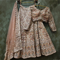 Embellished bridal lehenga set with multicolor threadwork, net dupatta, long sleeves