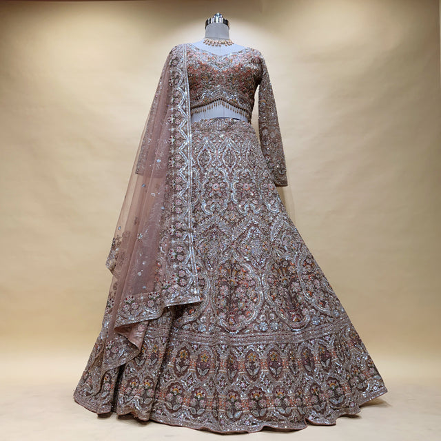 Dusty mauve bridal lehenga with silver zari embroidery, beaded motifs, net dupatta