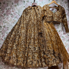Antique gold sequin work Celestial lehenga set with blouse and net dupatta on hanger