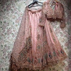 Baby pink Celestial lehenga set with blouse and heavy jaal dupatta on hanger