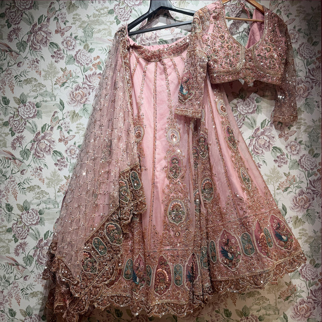 Baby pink Celestial lehenga set with blouse and heavy jaal dupatta on hanger