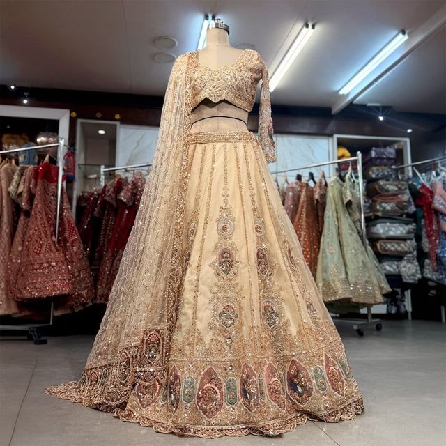 Ivory Celestial lehenga set with blouse and heavy jaal dupatta on mannequin