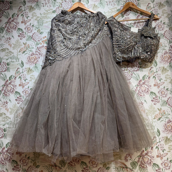 Smoke grey embellished net lehenga and sleeveless beaded blouse, draped yoke