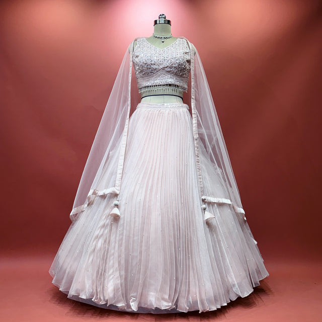 Baby pink organza lehenga with gathered skirt and matching tulle dupatta