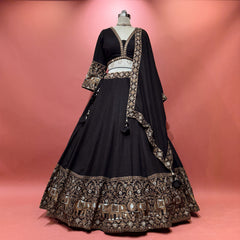 Black raw-silk lehenga with elephant motifs and gold embroidery border, full flare