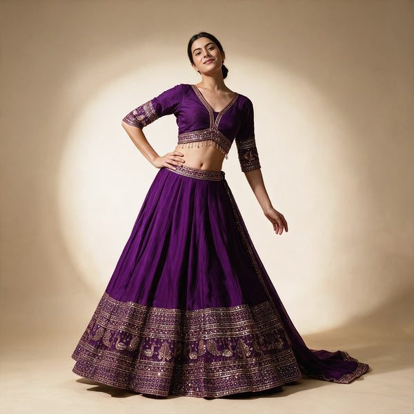 Purple lehenga with zari-mirror embroidered borders and 3/4 sleeve blouse