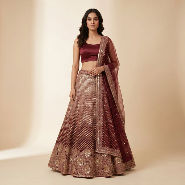 Maroon sequined lehenga skirt with matching blouse and sheer dupatta