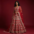 Deep red bridal lehenga with gold zari motif border and flared skirt