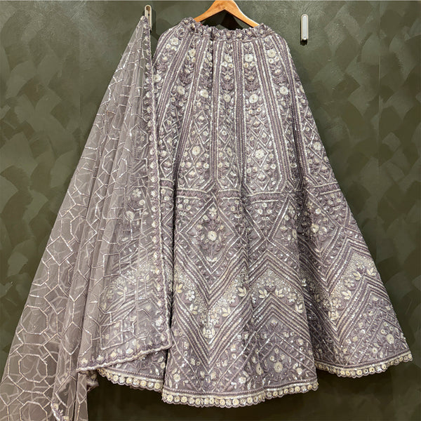 Lavender sequin and stone lehenga skirt with matching net dupatta on hanger