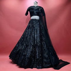Black sequined cocktail lehenga with long sleeves and flared pleated skirt