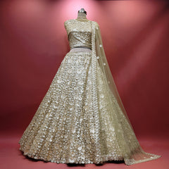 Gold net sequin lehenga with pearl-like floral motifs and full flare skirt