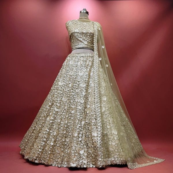 Gold net sequin lehenga with pearl-like floral motifs and full flare skirt