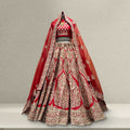 Red bridal lehenga with silver-gold embroidered panels and flared skirt hem