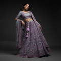 Embroidered purple lehenga with beaded tassel motifs, matching blouse and sheer dupatta
