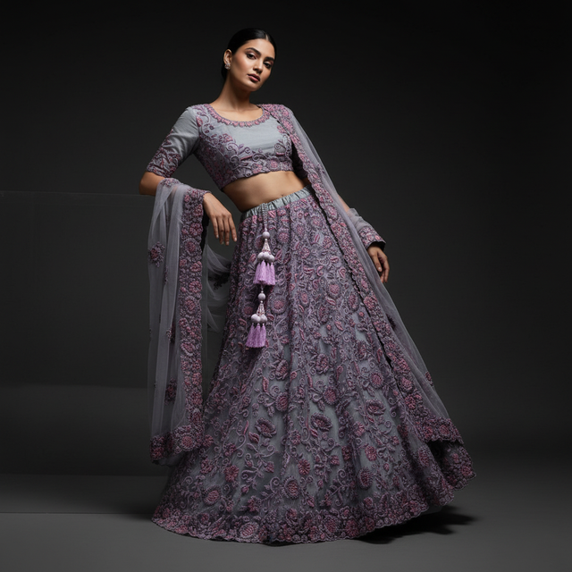 Embroidered purple lehenga with beaded tassel motifs, matching blouse and sheer dupatta