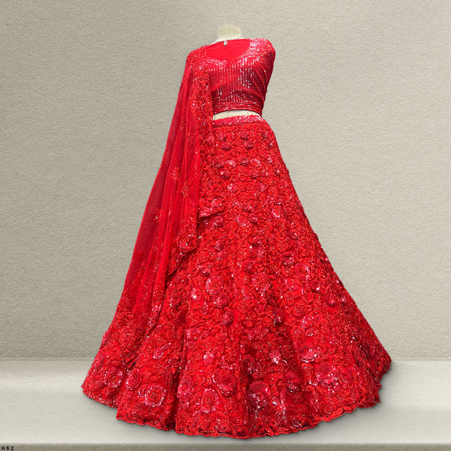 Red sequin lehenga skirt with sleeveless blouse and sheer embroidered dupatta