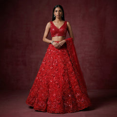 Red sequined lehenga set with sleeveless V-neck blouse and layered flared skirt