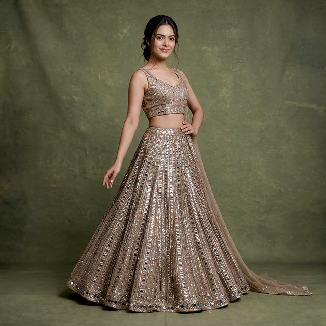 Damsel: Ivory Gold Net Mirror Handwork Reception Cocktail Lehenga