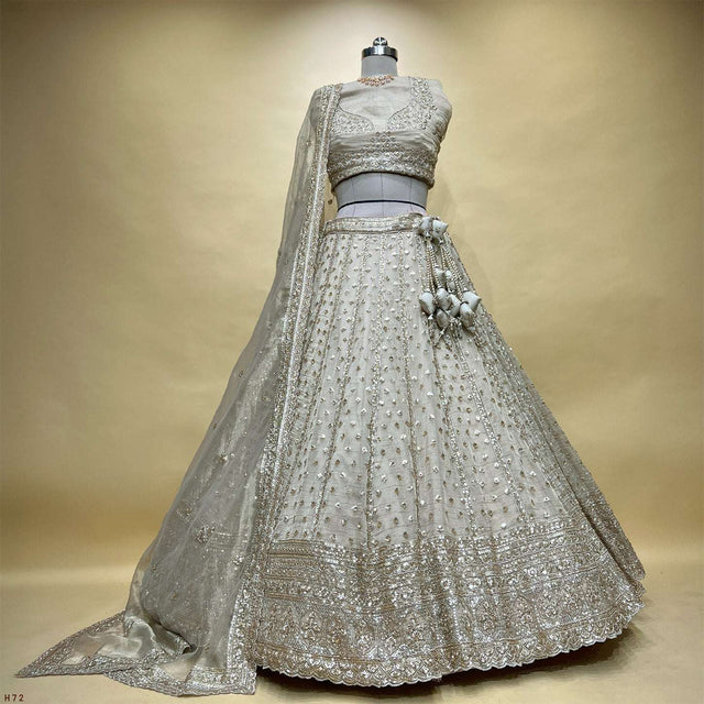 Ivory lehenga skirt with silver sequin embroidery and flared hem