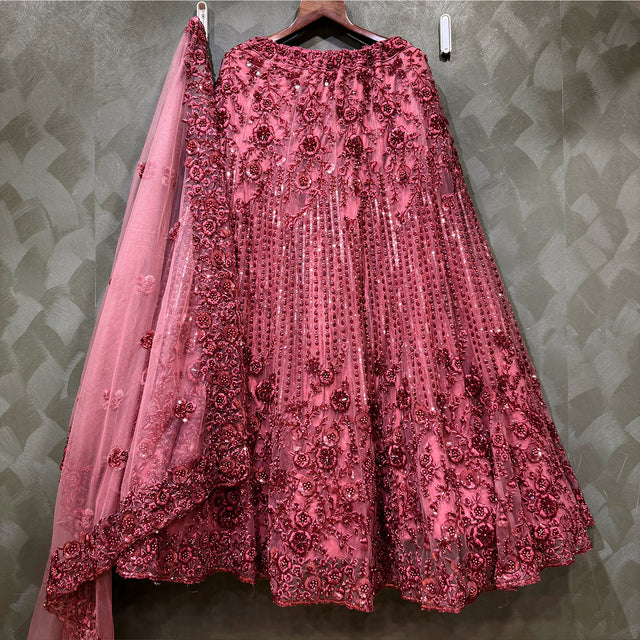Maroon lehenga skirt with dense floral embroidery and matching sheer dupatta