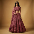Deep maroon tone-on-tone floral handwork lehenga with fitted blouse and flared skirt