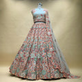 Pastel multicolor embroidered lehenga with 3D floral work and sheer matching dupatta