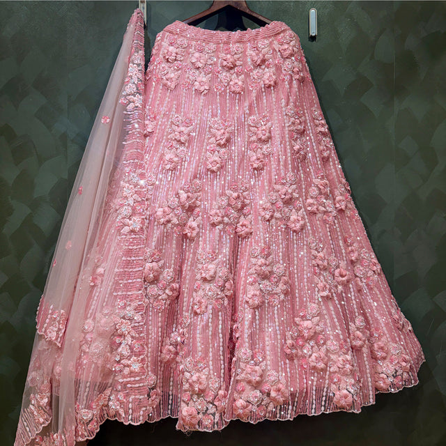 Rose pink net lehenga with intricate 3D floral applique, pleated tiered skirt
