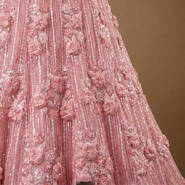 Baby pink net lehenga with 3D floral appliques and cutdana embellishment