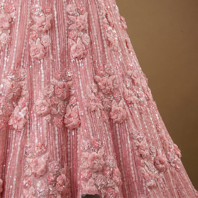 Close-up of pink 3D floral applique and beadwork on net lehenga skirt