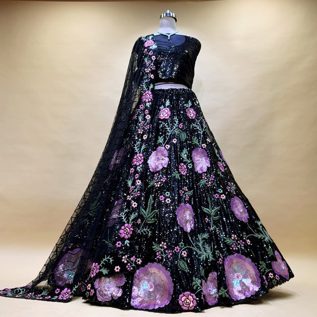 Black sequined lehenga on mannequin with pink floral cutdana embroidery and sheer dupatta