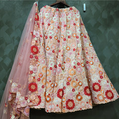 Embroidered blush lehenga skirt with multicolor circular motifs and sheer dupatta on hanger