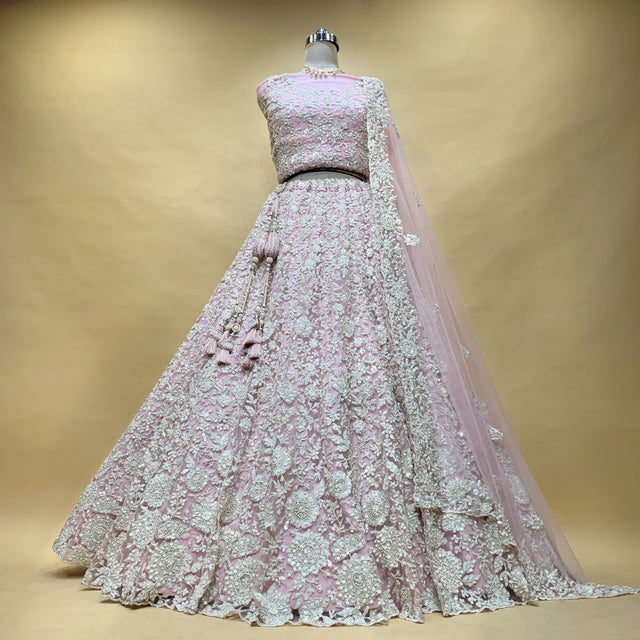Blush pink net lehenga with all-over cutdana embroidery and sheer dupatta panel