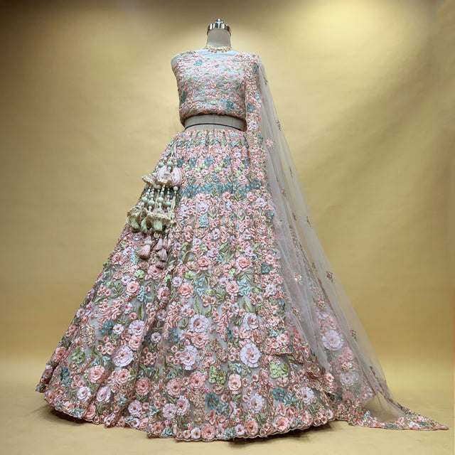 Pastel floral appliqué lehenga with 3D net flowers and matching dupatta