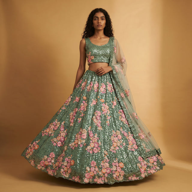 Teal green lehenga set with pink floral moti sequins and sheer dupatta
