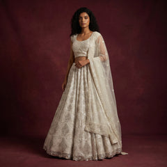 Off-white embellished lehenga with blouse and sheer dupatta, silver cutdana lattice