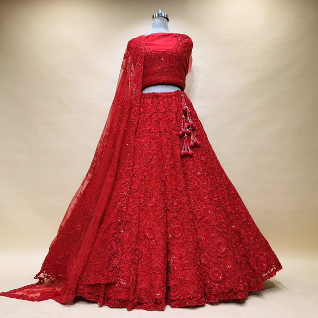 Red embroidered lehenga with floral sequins and sheer dupatta, flared skirt