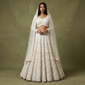 White embroidered lehenga with dupatta and floral 3D embellishment