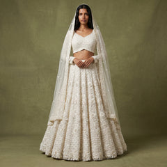 White embroidered lehenga with dupatta and floral 3D embellishment