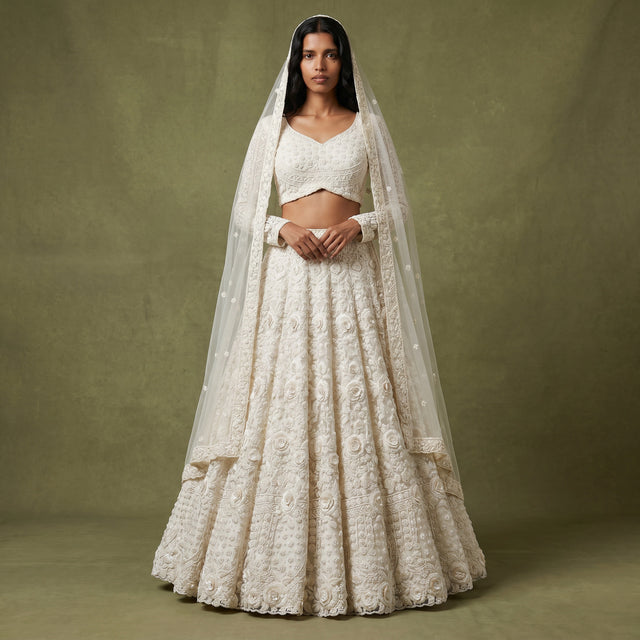 White embroidered lehenga with dupatta and floral 3D embellishment