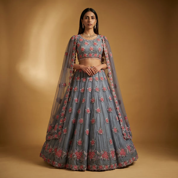 Dove grey lehenga with multicolor floral embroidery and pre-draped sheer cape dupatta