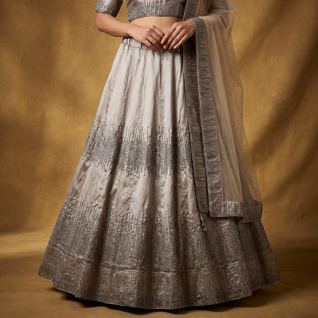 Silvery flared lehenga skirt with dense moti detailing and bordered sheer dupatta