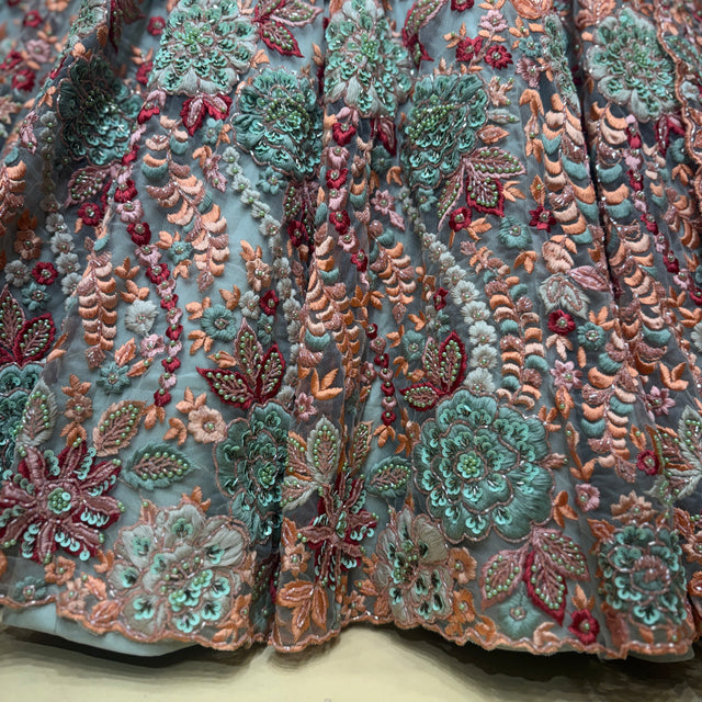 Teal, coral and pink 3D floral embroidered lehenga fabric close-up