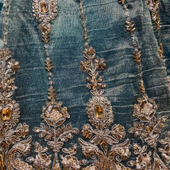 Teal lehenga fabric with ornate gold, silver and crystal beadwork and stone accents