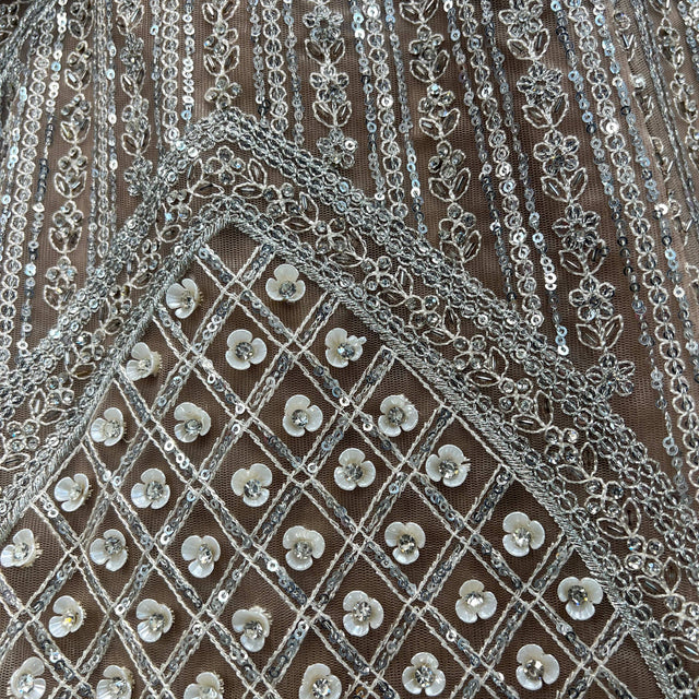Silver sequin net fabric with diamond lattice and small floral motifs